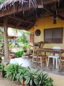 an outdoor patio with a table and chairs at Goldsky Seaview Resort in San Juan