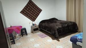 Ein Bett oder Betten in einem Zimmer der Unterkunft Misky Wasi
