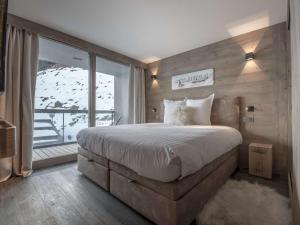 Katil atau katil-katil dalam bilik di Appartement 76m², 6-7 pers, Courchevel Village, pied des pistes, centre, balcon, spa, parking, Wi-Fi. - FR-1-631-202