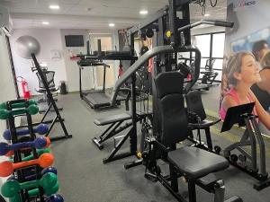 a woman in a gym with machines at Mercure Recife Navegantes - Privado in Recife