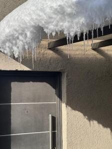 a bunch of icicles hanging from the roof of a building at 3H MALARGUE Monoambiente in Malargüe