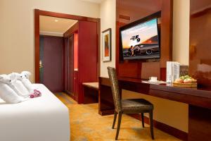 TV a/nebo společenská místnost v ubytování New Jiuzhai Hotel