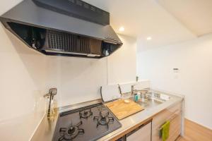 Una cocina o kitchenette en 東京新築85平米駅徒歩6分最大8名無料駐車場東京上野秋葉原駅直通