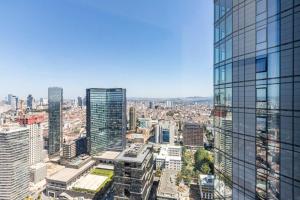 an aerial view of a city with tall buildings at Beautiful Bright Deluxe 1bd Condo Poolviews! #311 in Istanbul