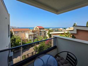 a balcony with a view of a city at ND Apartments in Bar