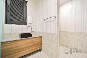 Koupelna v ubytování Brown Dot Hotel Guun