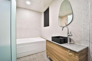 Koupelna v ubytování Brown Dot Hotel Guun