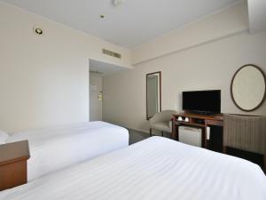 TV a/nebo společenská místnost v ubytování Rihga Hotel Zest Takamatsu