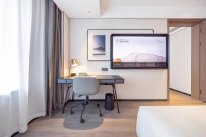 Postelja oz. postelje v sobi nastanitve Atour Hotel Jinan Shandong International Convention and Exhibition Center Ikea