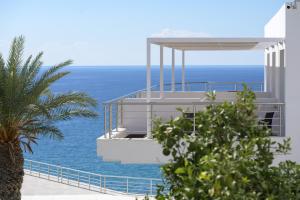 a building with a view of the ocean at Porto Belissario in Ferma