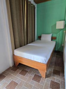 Postel nebo postele na pokoji v ubytování Tortuguero Hill Rooms