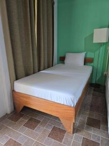Postel nebo postele na pokoji v ubytování Tortuguero Hill Rooms