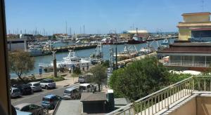 a view of a marina with boats in the water at Casa Marzio Apartments in Fiumicino