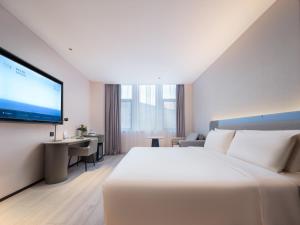 TV a/nebo společenská místnost v ubytování Atour Light Hotel Dalian Zhongshan Square Renming Road