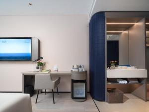 TV a/nebo společenská místnost v ubytování Atour Light Hotel Dalian Zhongshan Square Renming Road