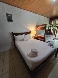 Postel nebo postele na pokoji v ubytování Tortuguero Hill Rooms