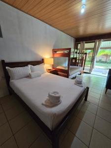 Postel nebo postele na pokoji v ubytování Tortuguero Hill Rooms