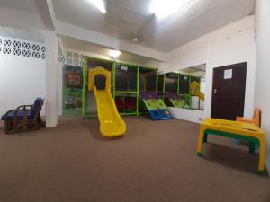 a kids room with a slide and a play area at Unit 606 Seabrook in Margate