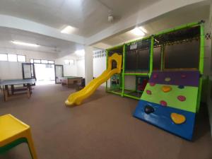a play room with a slide and a slideintend at Unit 606 Seabrook in Margate