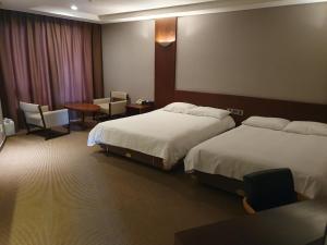 Postel nebo postele na pokoji v ubytování Mstay Hotel