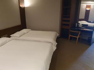 Postel nebo postele na pokoji v ubytování Mstay Hotel