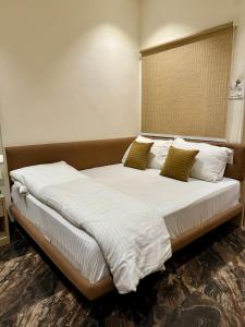 Postel nebo postele na pokoji v ubytování Hotel Sajanshree