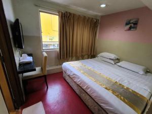 Postel nebo postele na pokoji v ubytování HOTEL BINTANG