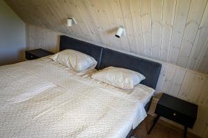 Postel nebo postele na pokoji v ubytování Lüübnitsa Külalismaja