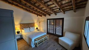 Postel nebo postele na pokoji v ubytování Masos Bruguera - Finca Llambrich