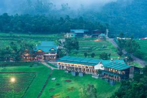 an aerial view of a resort in a field at Destiny - The Farm Resort in Ooty
