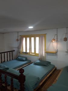 Postel nebo postele na pokoji v ubytování Ở Mô Dalat
