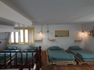 Postel nebo postele na pokoji v ubytování Ở Mô Dalat