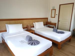 Postel nebo postele na pokoji v ubytování Samed Cabana Resort