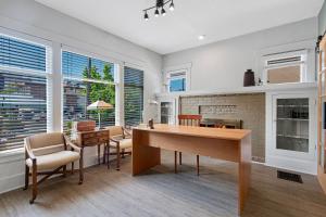 a living room with a desk and a fireplace at Vintage 3 Bedroom Home in Prime Eastlake Seattle with Private Parking in Seattle +24 photos