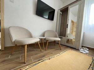 Télévision ou salle de divertissement dans l'établissement Apartment Phillip Studio