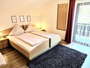 Postel nebo postele na pokoji v ubytování Apartments Fasl