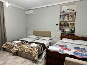 Postel nebo postele na pokoji v ubytování Guest House Maia
