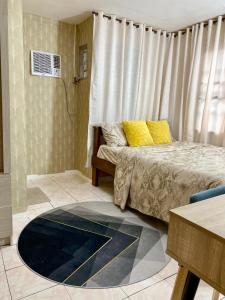 Katil atau katil-katil dalam bilik di Butuan Cozy House Gated Parking