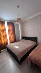 Postel nebo postele na pokoji v ubytování საოჯახო სასტუმრო რაჭაში