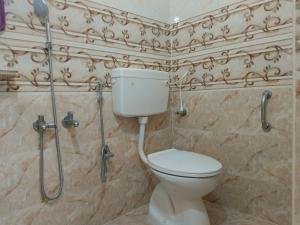 Koupelna v ubytování SRI NILAYAM Inn + 16 fotografií
