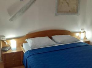 Postel nebo postele na pokoji v ubytování Guest House Green Corner Supetarska Draga