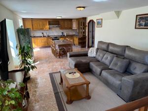 a living room with a couch and a table at Casa de Mucha in Camariñas