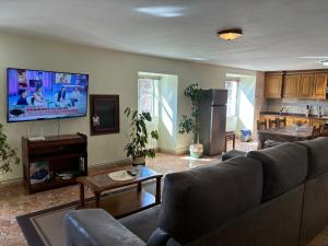 a living room with a couch and a table at Casa de Mucha in Camariñas