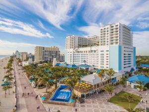 an aerial view of a resort with a swimming pool at Hallandale Mins From Beach & Aventura Mall Hn01 in Hallandale Beach