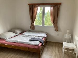 Postel nebo postele na pokoji v ubytování Penzion Cholín