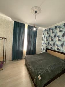 Postel nebo postele na pokoji v ubytování საოჯახო სასტუმრო რაჭაში