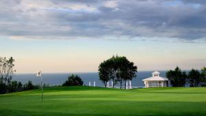 a golf course with a gazebo on a green at SeaView Golf Villa in Balchik