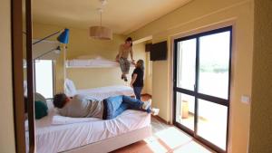 Cama ou camas em um quarto em WOT Sintra Ocean