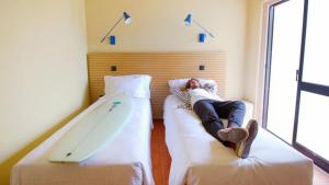 Cama ou camas em um quarto em WOT Sintra Ocean
