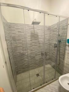 a shower with a glass door in a bathroom at A Petrazzi in Castellammare del Golfo